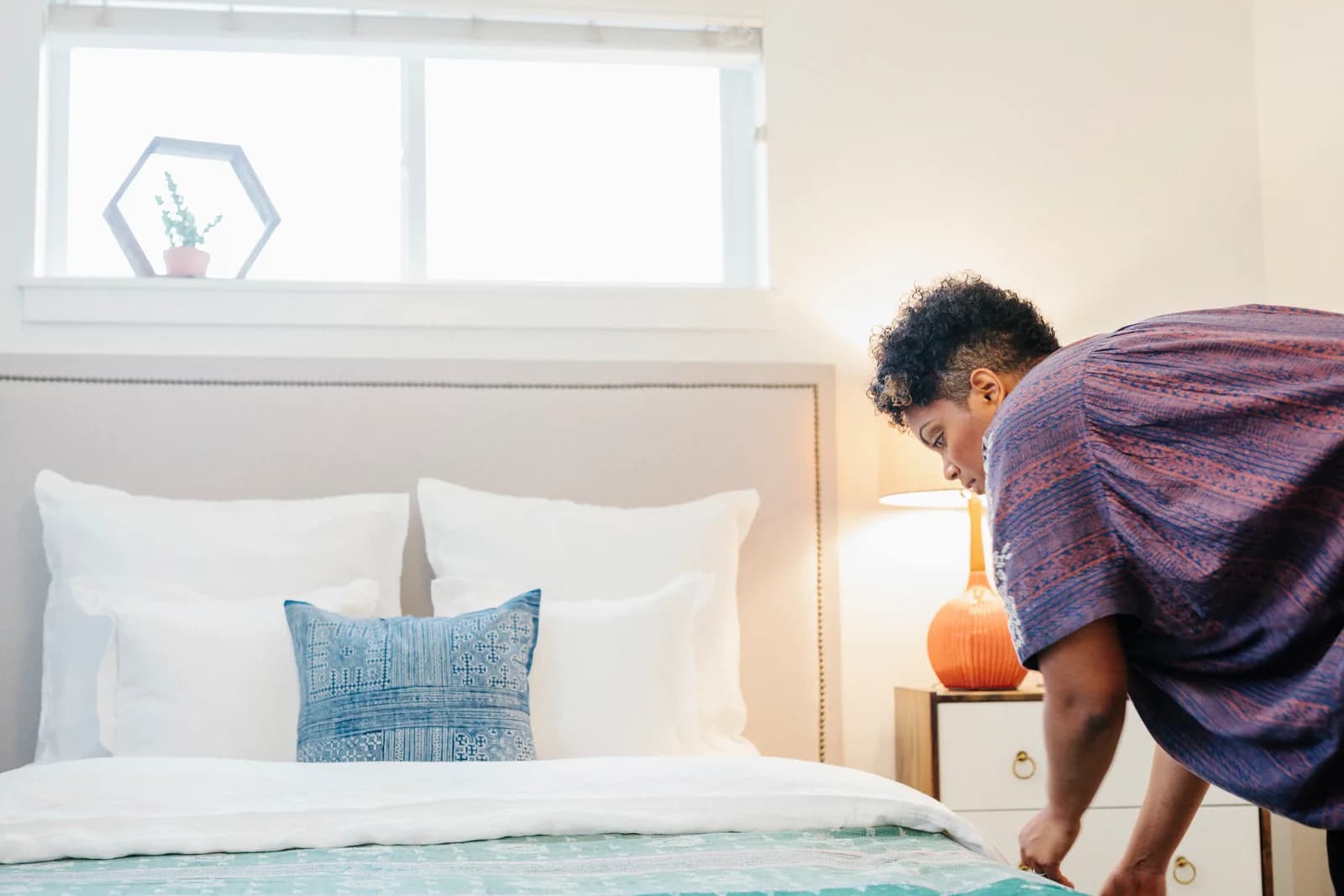 Styled, guest-ready holiday let bedroom with crisp white linen